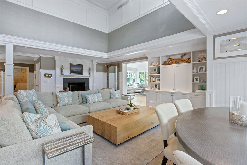 207 Pineleigh Path Barnstable, MA 02655 - Photo 14 of 42 a living room with furniture and a table