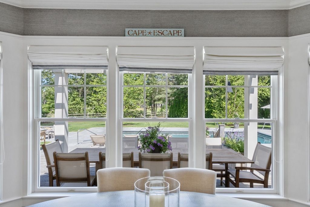 207 Pineleigh Path Barnstable, MA 02655 - Photo 16 of 42 a living room with furniture and a large window
