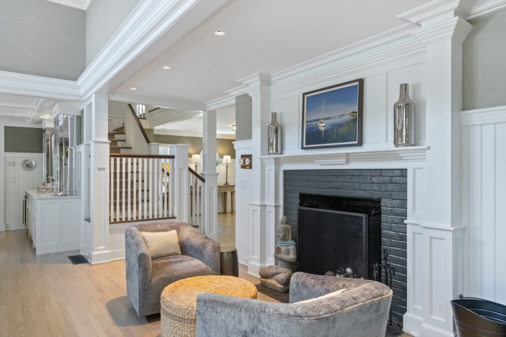 207 Pineleigh Path Barnstable, MA 02655 - Photo 17 of 42 a living room with furniture and a fireplace