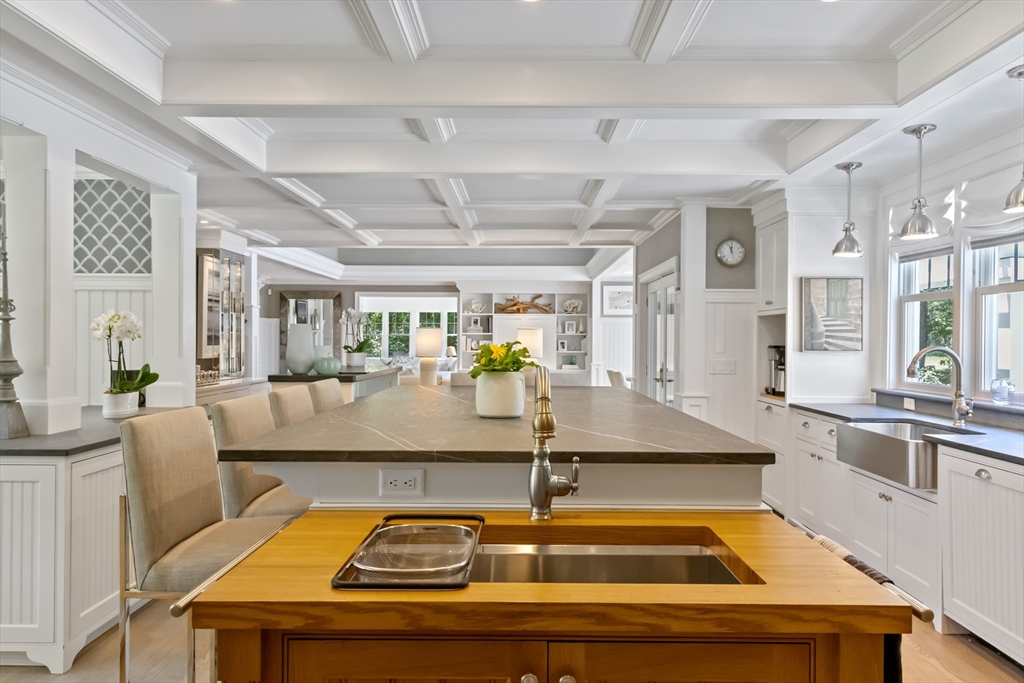 207 Pineleigh Path Barnstable, MA 02655 - Photo 20 of 42 a kitchen with stainless steel appliances granite countertop a sink and a stove