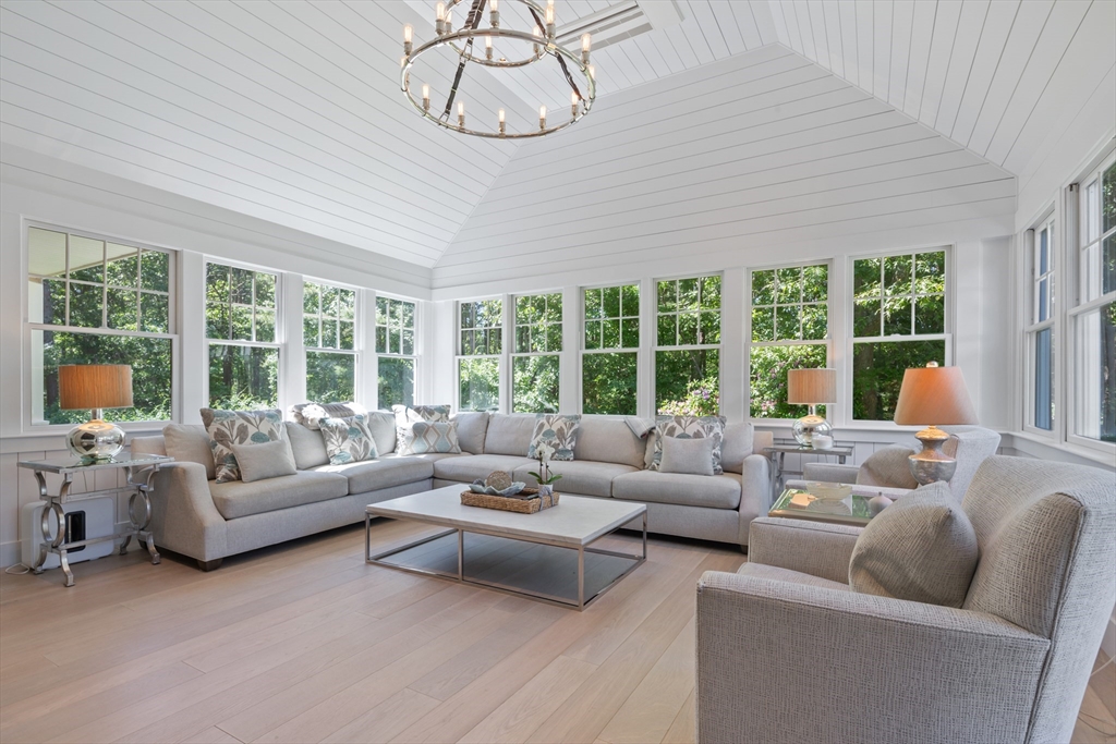 207 Pineleigh Path Barnstable, MA 02655 - Photo 27 of 42 a living room with furniture and a large window