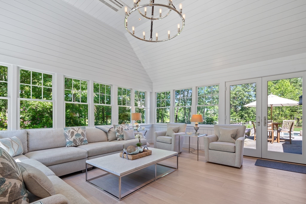 207 Pineleigh Path Barnstable, MA 02655 - Photo 28 of 42 a living room with furniture and a large window