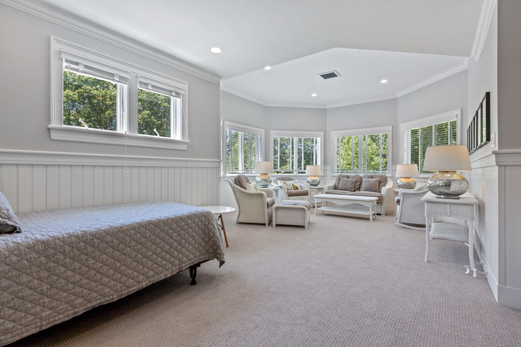 207 Pineleigh Path Barnstable, MA 02655 - Photo 34 of 42 a bedroom with furniture and a large window