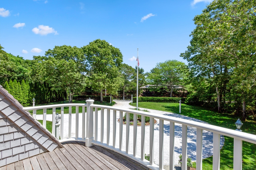 207 Pineleigh Path Barnstable, MA 02655 - Photo 39 of 42 a view of a wooden deck next to a yard