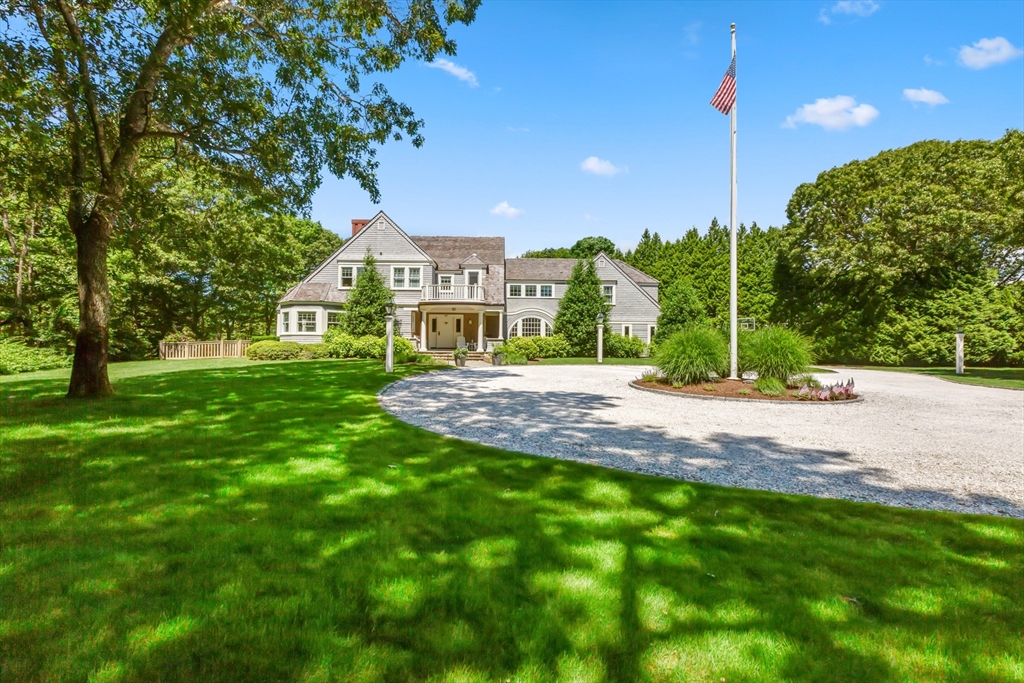 207 Pineleigh Path Barnstable, MA 02655 - Photo 4 of 42 a front view of a house with a yard