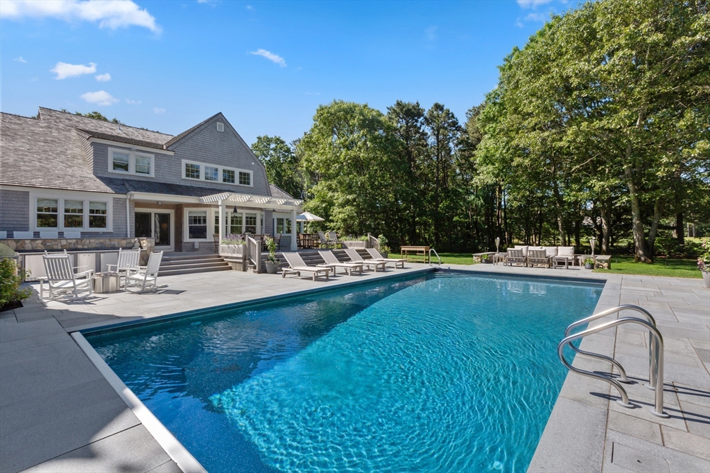 207 Pineleigh Path Barnstable, MA 02655 - Photo 41 of 42 a view of a house with swimming pool and sitting area