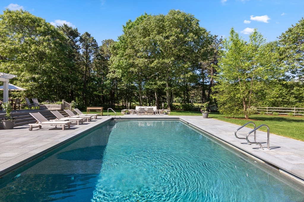 207 Pineleigh Path Barnstable, MA 02655 - Photo 8 of 42 a view of a swimming pool with a patio