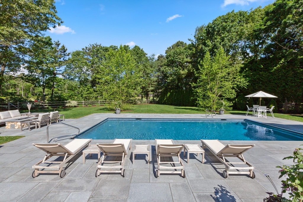 207 Pineleigh Path Barnstable, MA 02655 - Photo 9 of 42 a view of yard with seating area and trees