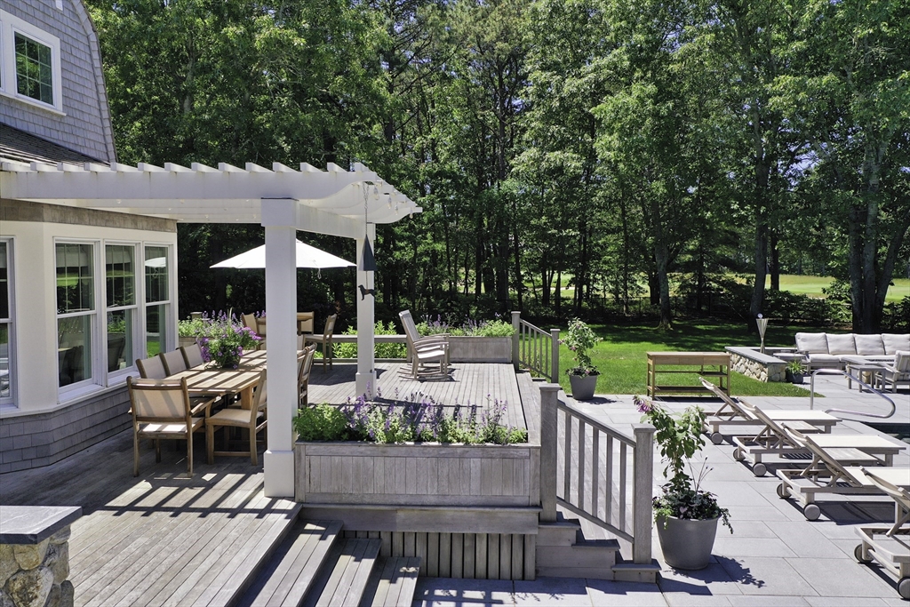 207 Pineleigh Path Barnstable, MA 02655 - Photo 10 of 42 a view of a patio with couches chairs and a yard