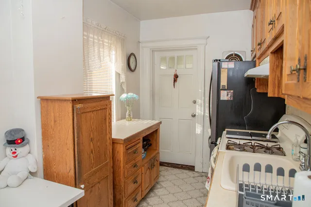 a room with a chandelier furniture and windows