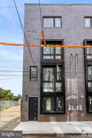 a brick building with a street