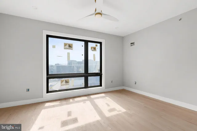 a view of an empty room with a window