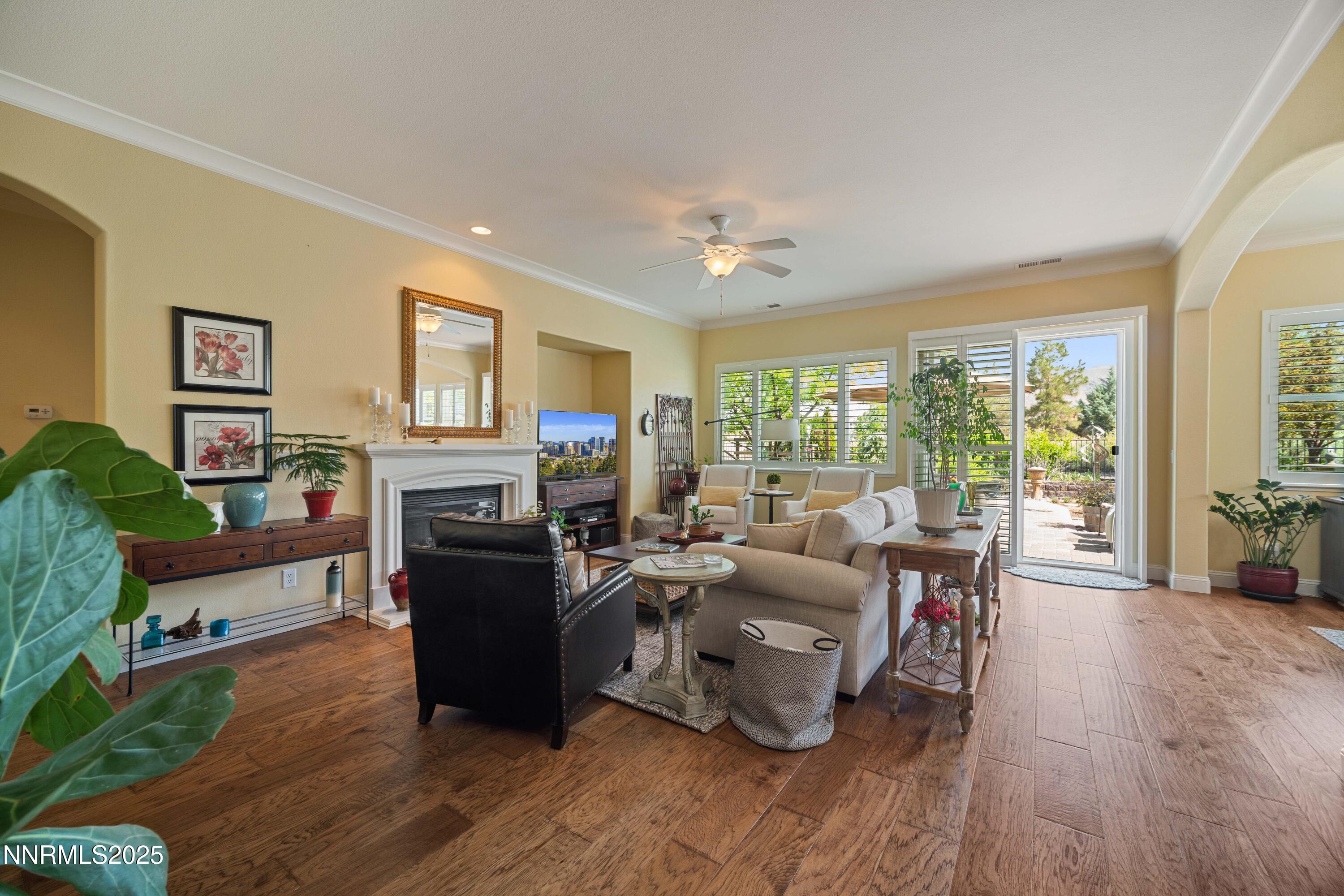 10100 Cavalry Circle Reno, NV 89521 - Photo 5 of 43 a living room with fireplace furniture and a large window