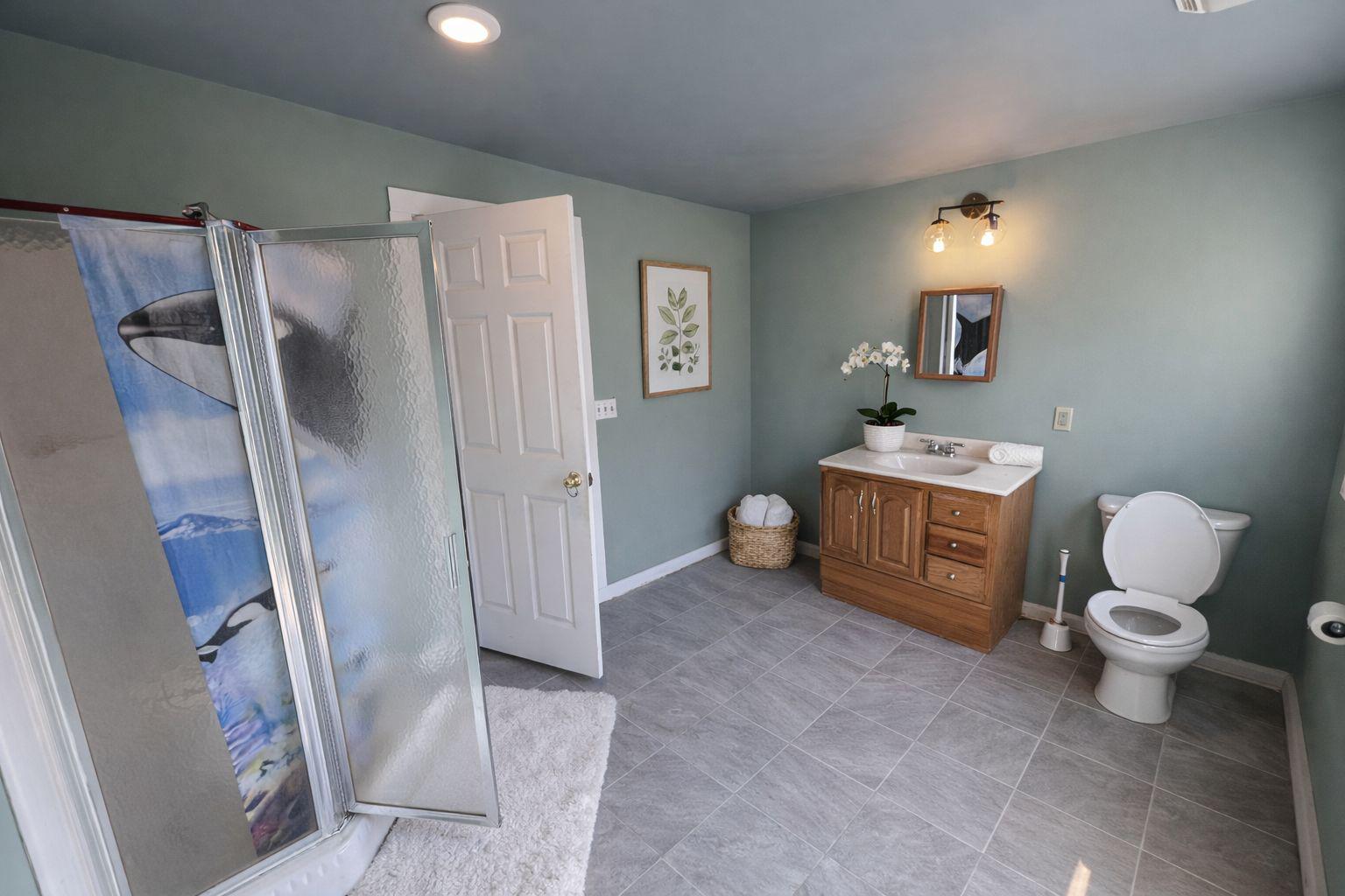810 Locust Street Cambridge, MD 21613 - Photo 13 of 19 AI edited version of bathroom