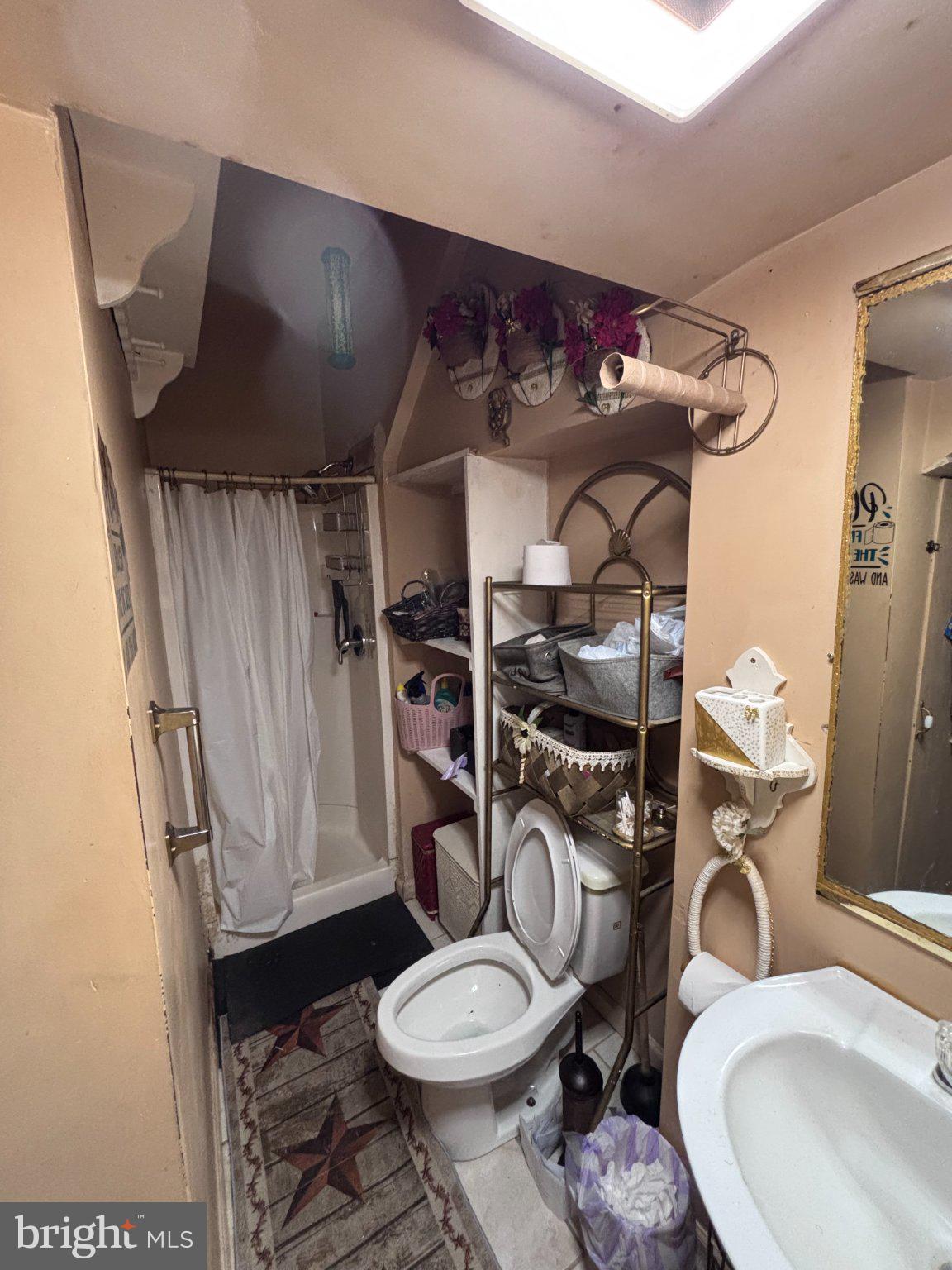 810 Locust Street Cambridge, MD 21613 - Photo 14 of 19 Charming compact bathroom retreat.