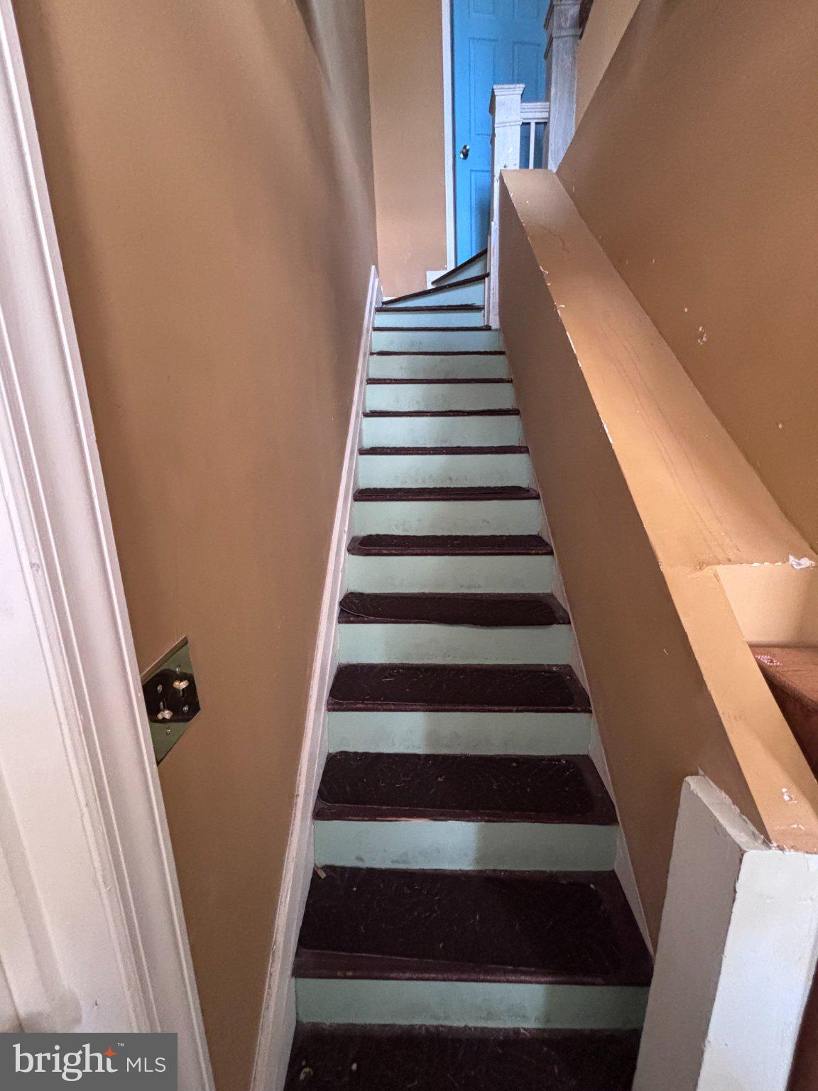810 Locust Street Cambridge, MD 21613 - Photo 18 of 19 Charming staircase with vintage flair.