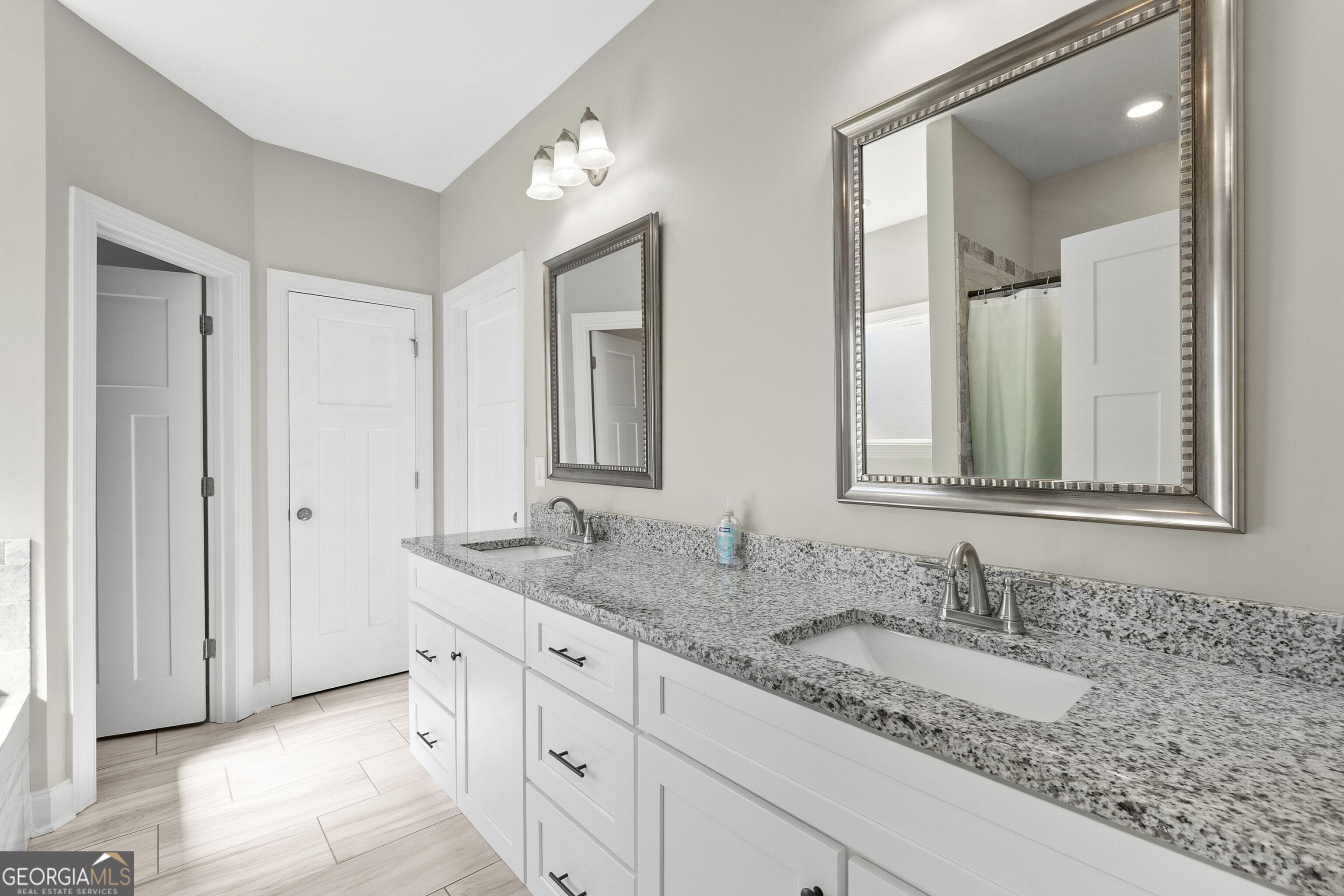 1101 Adirondac Way Bonaire, GA 31005 - Photo 17 of 31 a bathroom with a granite countertop double vanity sink and a mirror