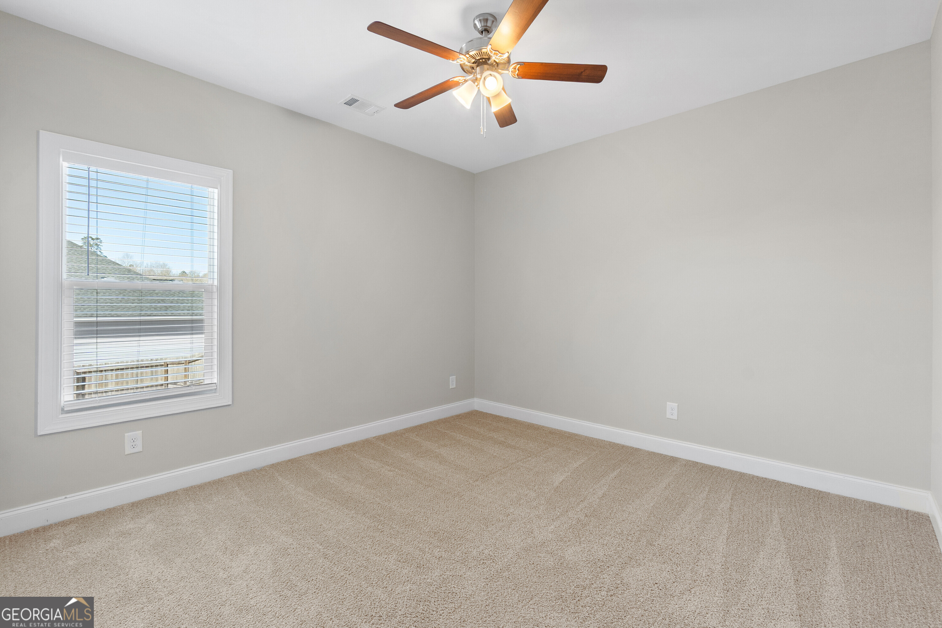 1101 Adirondac Way Bonaire, GA 31005 - Photo 21 of 31 an empty room with a window and a fan