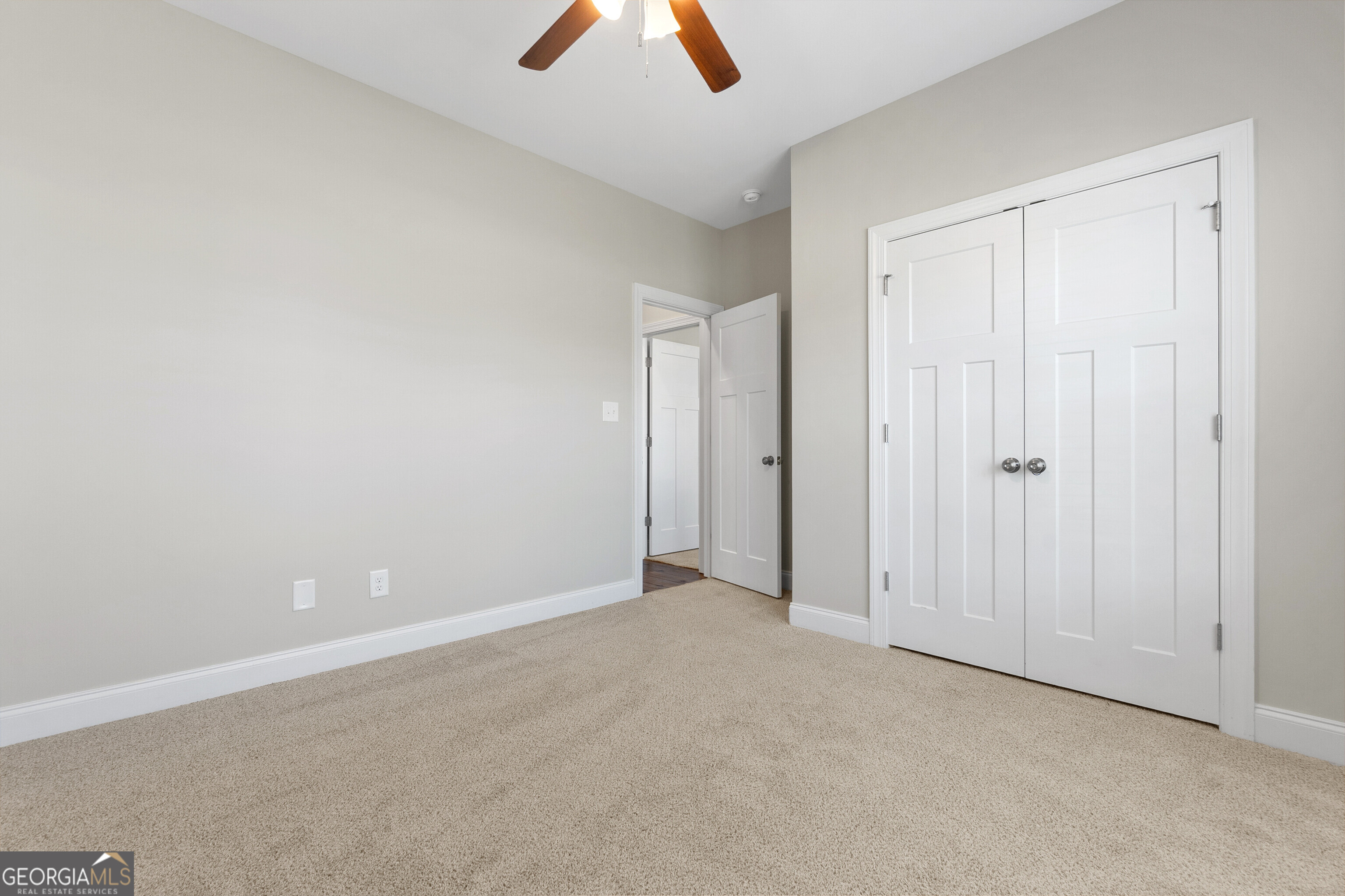 1101 Adirondac Way Bonaire, GA 31005 - Photo 28 of 31 an empty room with closet and a chandelier fan