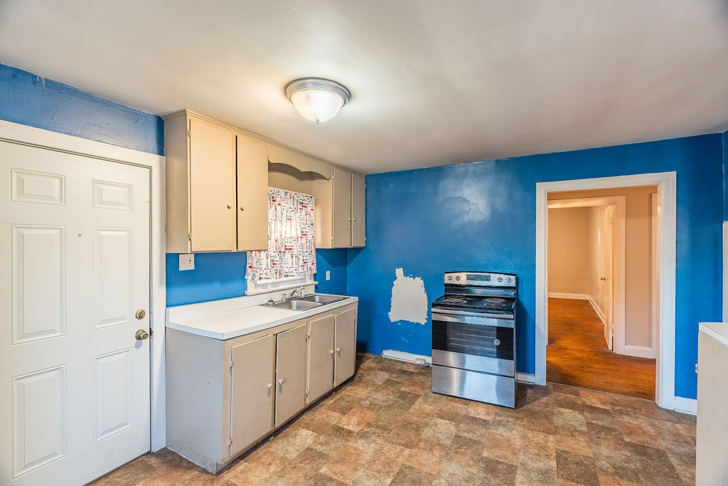 3511 Lafayette Road Hopkinsville, KY 42240 - Photo 7 of 19 a kitchen that has a sink and a stove