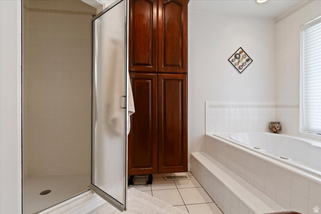 1924 North 2000th Street East Layton, UT 84040 - Photo 24 of 41 Full bathroom with a shower stall, light tile patterned floors, and a garden tub