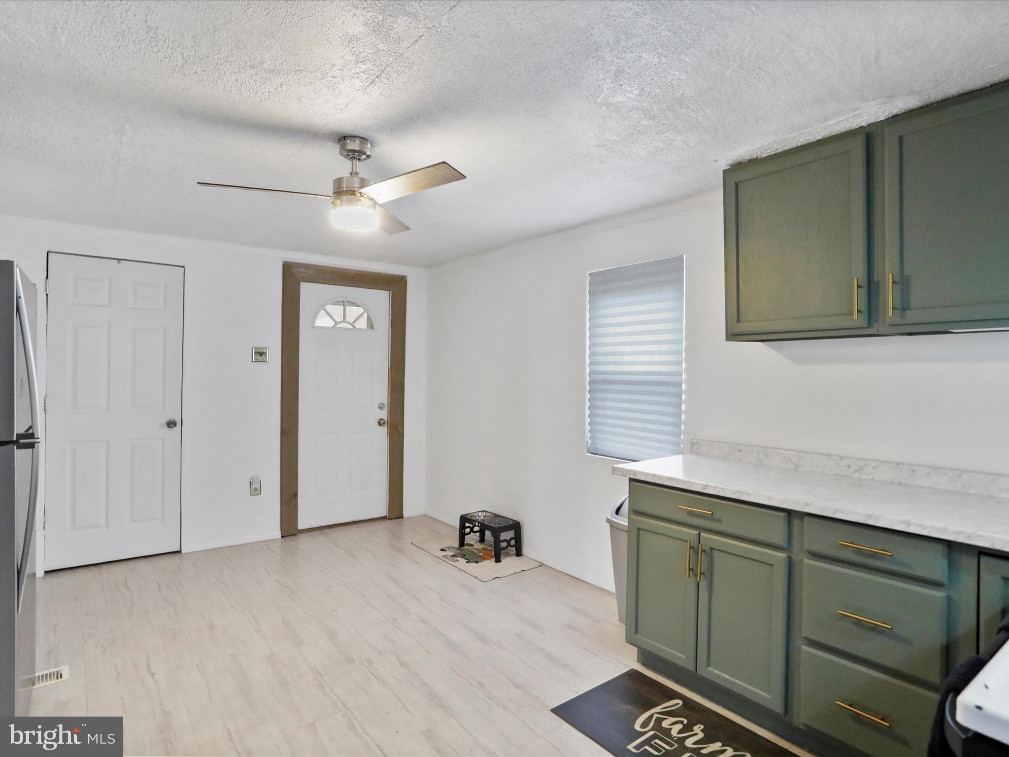 16112 Calla Hill Road Northwest Mount Savage, MD 21545 - Photo 12 of 27 a room with cabinets and a ceiling fan