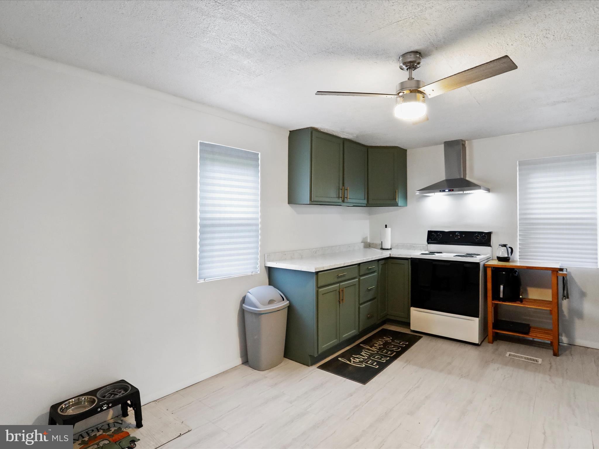 16112 Calla Hill Road Northwest Mount Savage, MD 21545 - Photo 13 of 27 a kitchen with granite countertop a stove and a sink