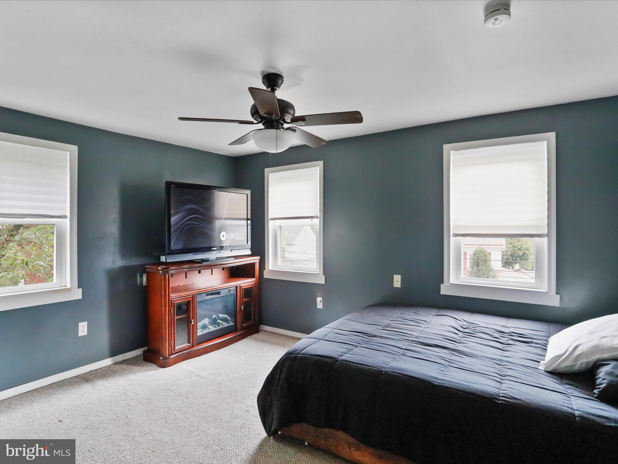 16112 Calla Hill Road Northwest Mount Savage, MD 21545 - Photo 19 of 27 a bedroom with a bed and a flat screen tv