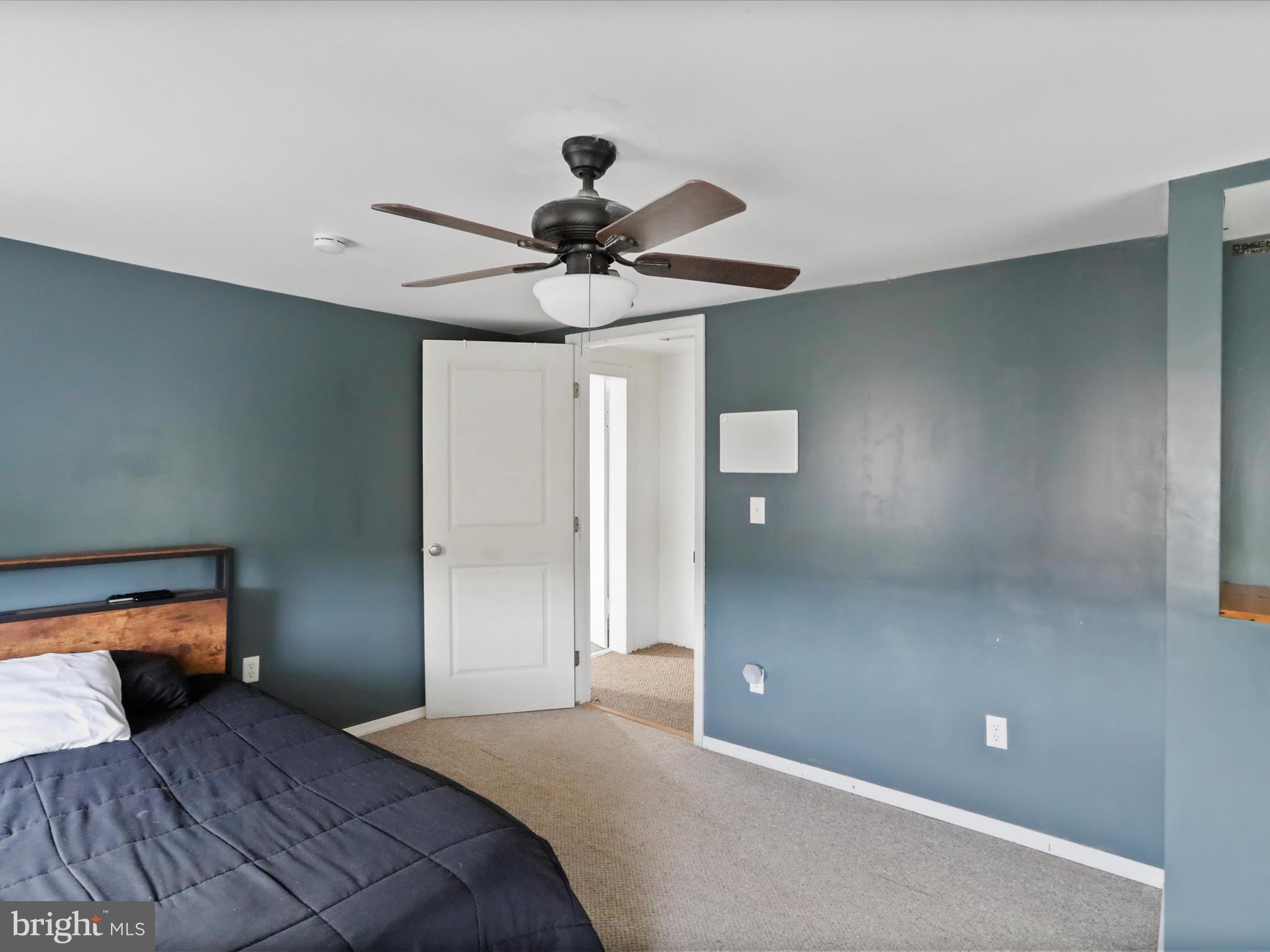 16112 Calla Hill Road Northwest Mount Savage, MD 21545 - Photo 20 of 27 a bedroom with a bed and a chandelier