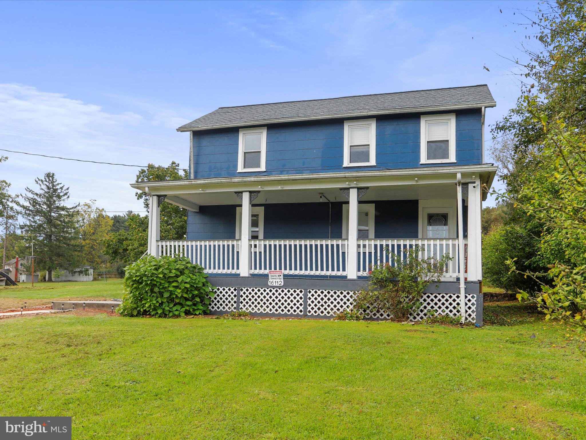 16112 Calla Hill Road Northwest Mount Savage, MD 21545 - Photo 2 of 27 a front view of a house with a garden