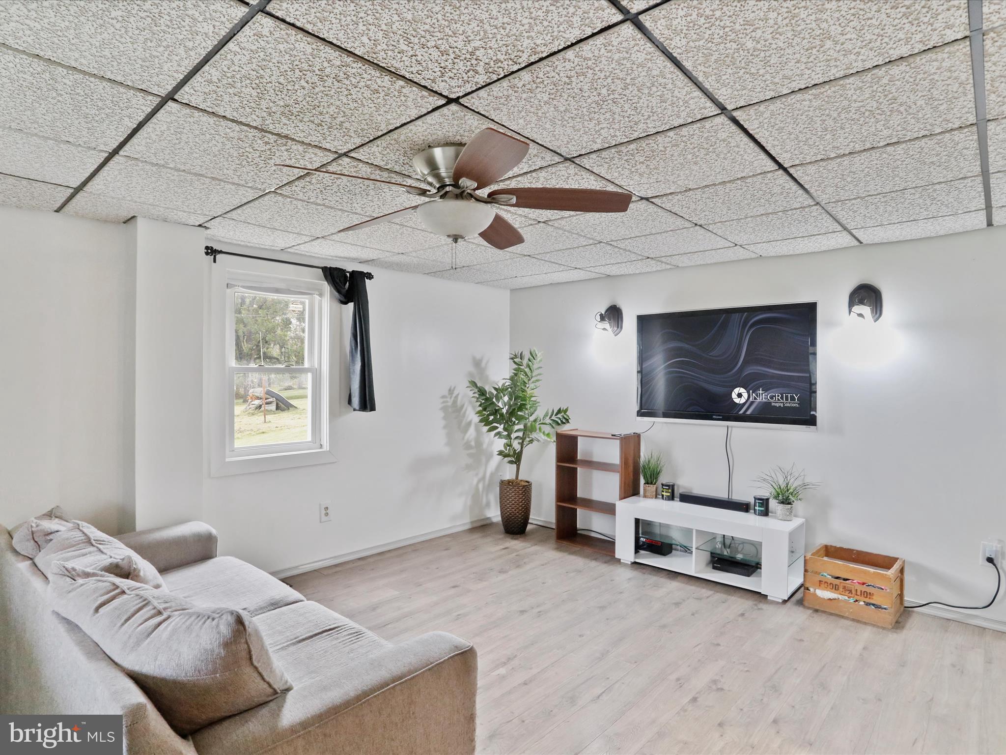 16112 Calla Hill Road Northwest Mount Savage, MD 21545 - Photo 4 of 27 a living room with furniture and a flat screen tv