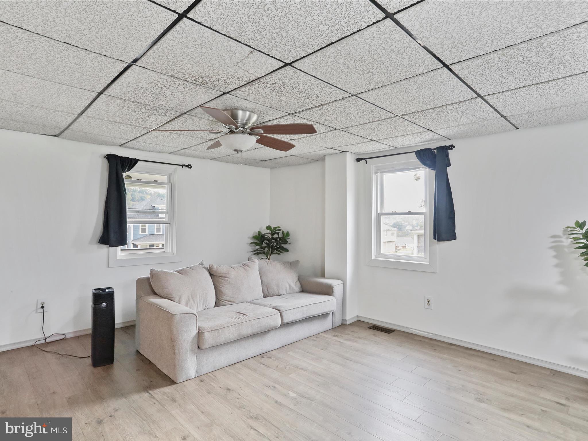 16112 Calla Hill Road Northwest Mount Savage, MD 21545 - Photo 5 of 27 a living room with furniture and a potted plant