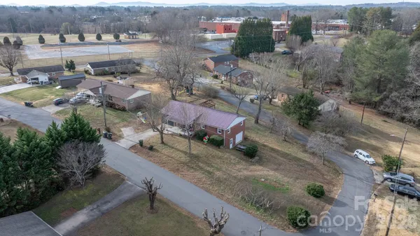 an aerial view of a houses with outdoor space
