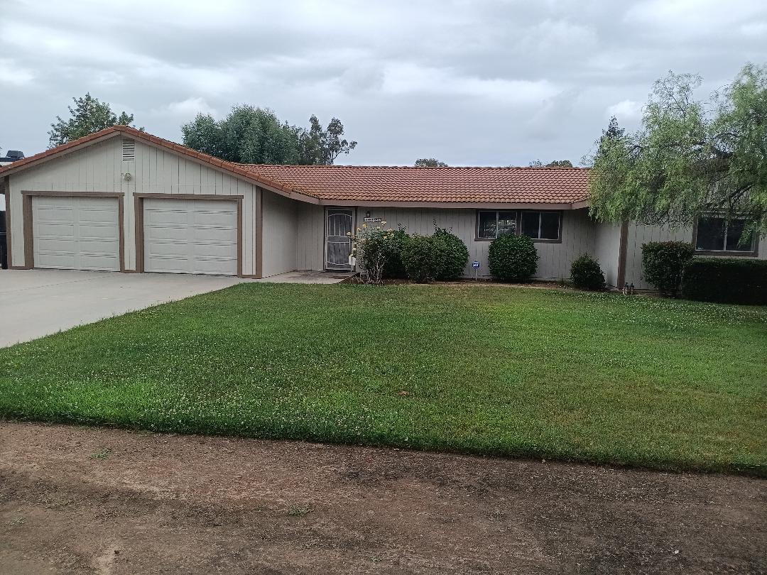 a view of a house with a garden