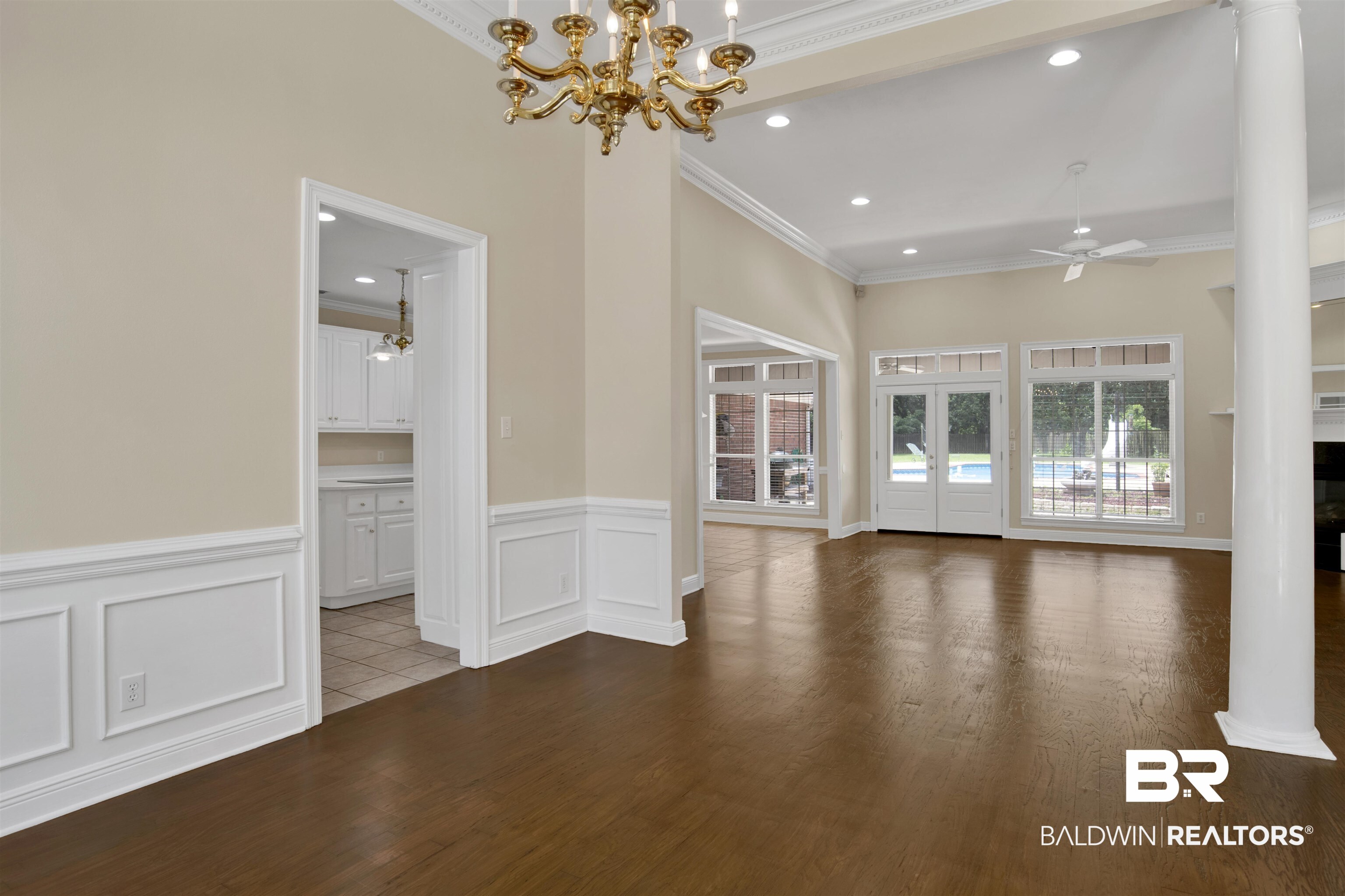 8847 Dawes Lake Road South Mobile, AL 36619 - Photo 34 of 47 Expansive room featuring dark wood-finish flooring, high ceilings with recessed lighting, and crown molding