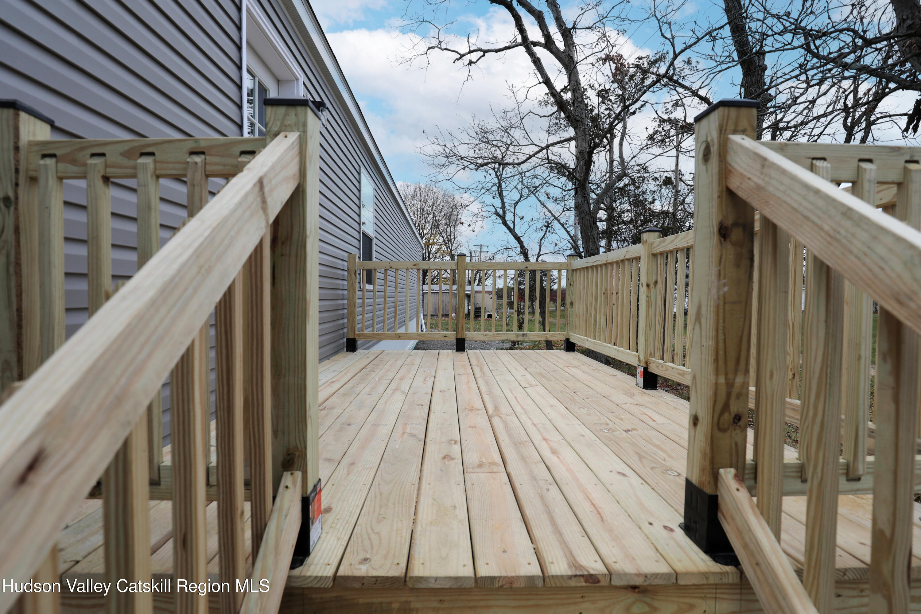 414 Joslen Boulevard, Unit 24 Hudson, NY 12534 - Photo 3 of 9 a view of outdoor space and deck