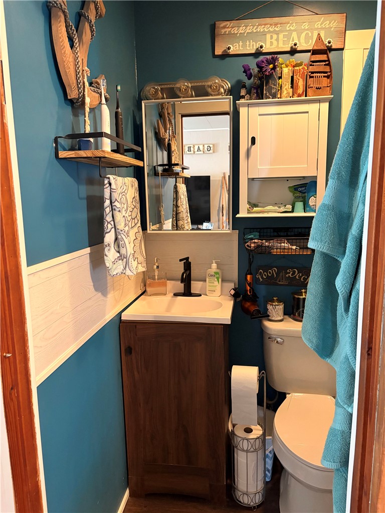 321 Liberty Street Eaton, OH 45320 - Photo 34 of 34 This cozy bathroom features a vanity with ample storage and a sleek, modern faucet.