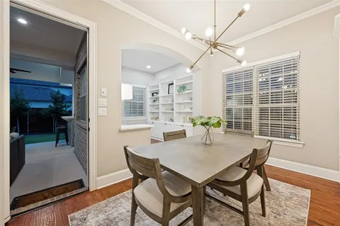 a view of a dining room with furniture and window