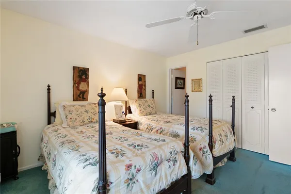 a bed room with bed and a window