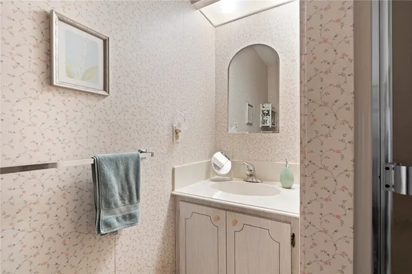a bathroom with a sink and a mirror