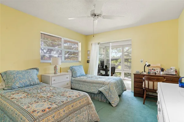 a bedroom with a bed and a table