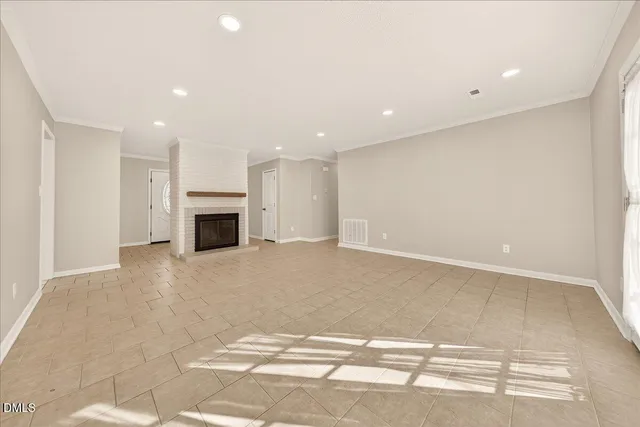 a living room with a fireplace and a rug
