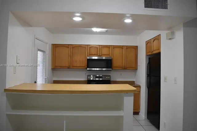 a bathroom with a sink a large mirror and a shower