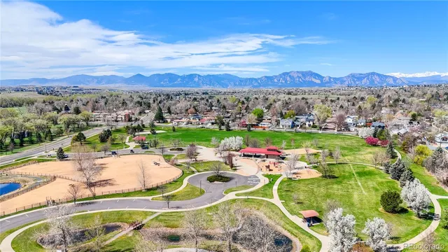 a view of a swimming pool with lawn chairs