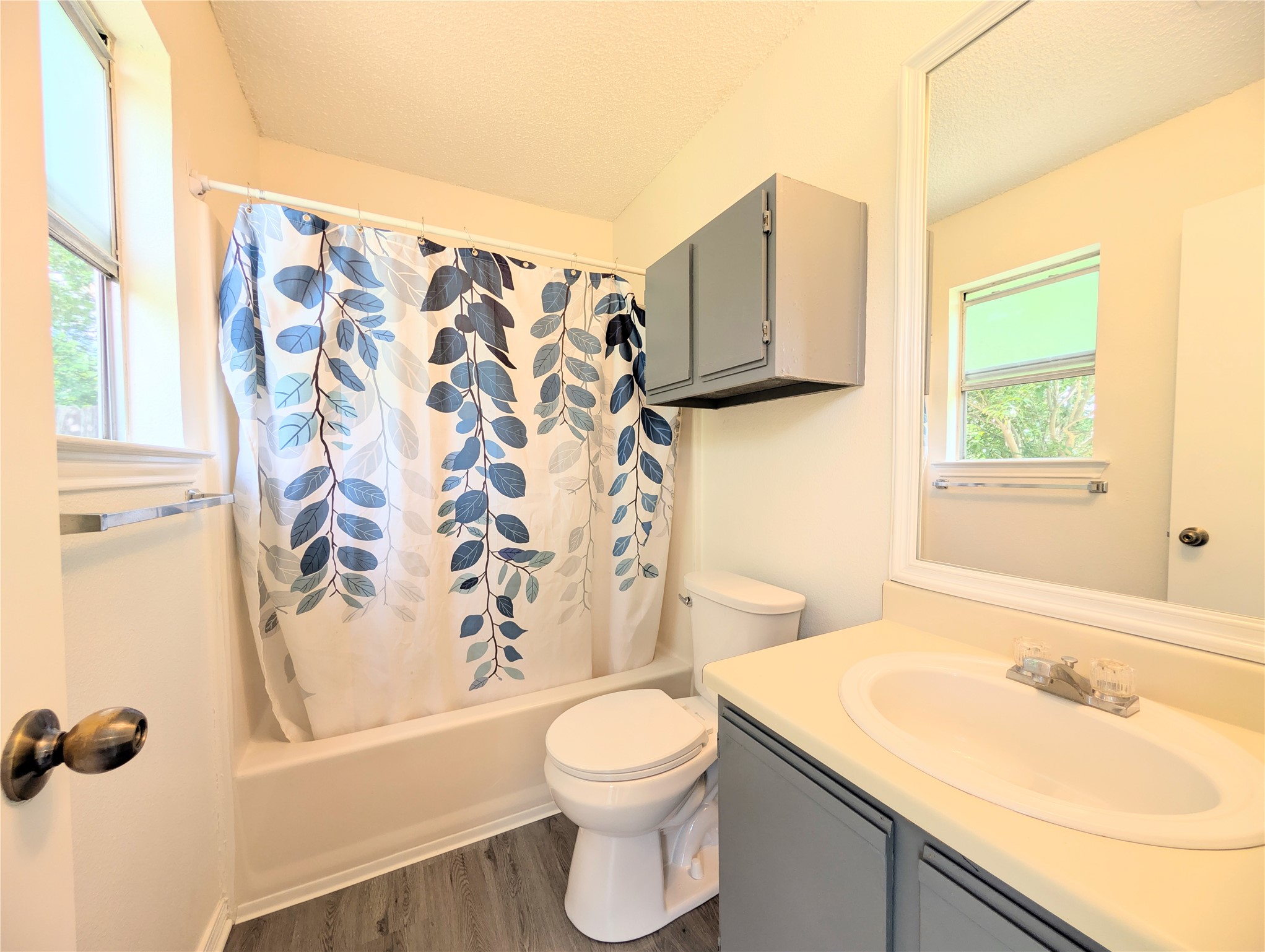 2036 Redwing Way Round Rock, TX 78664 - Photo 17 of 23 Primary Bathroom
Functional full bathroom featuring a tub-shower combination, modern vanity, and natural light from a window.