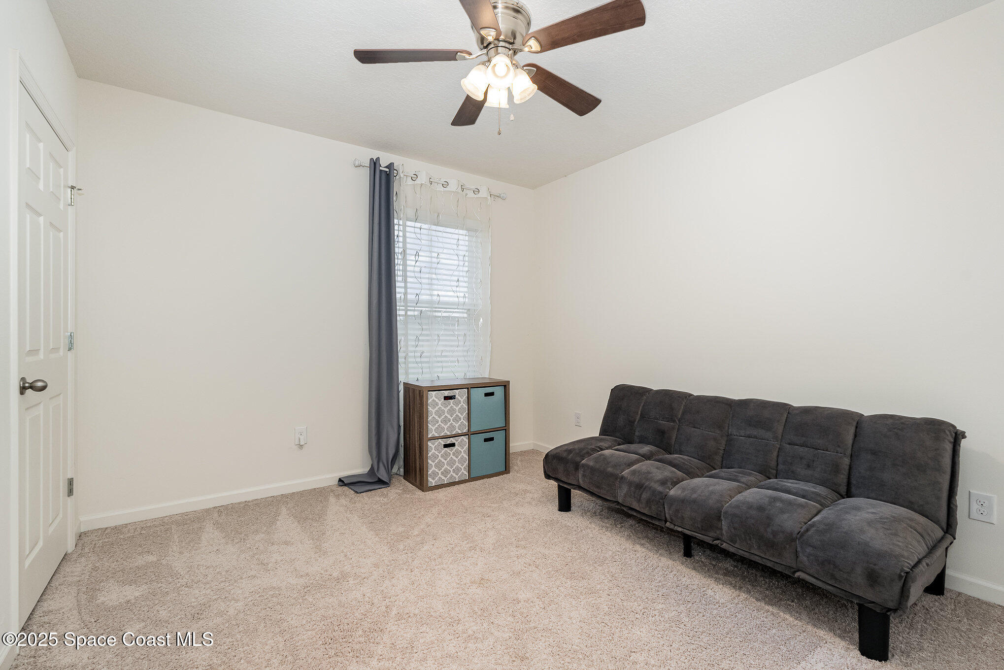 735 Sorrento Drive Cocoa, FL 32922 - Photo 15 of 23 a living room with furniture and a ceiling fan