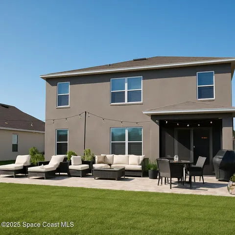 a view of a house with backyard porch and sitting area