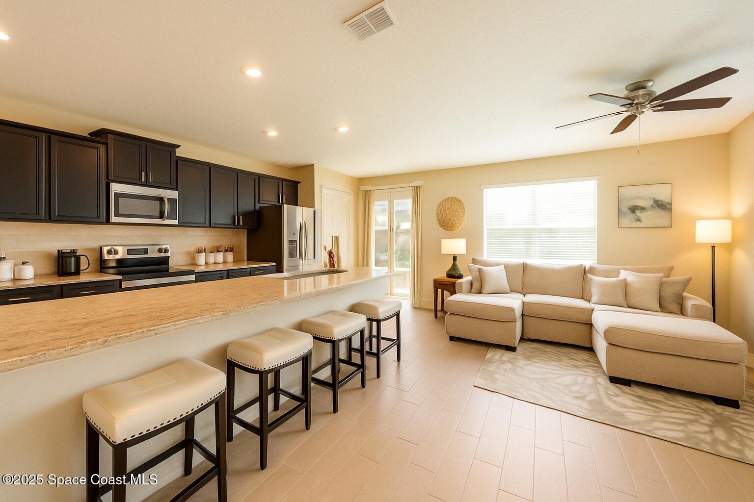 735 Sorrento Drive Cocoa, FL 32922 - Photo 7 of 23 a living room with furniture and a large window
