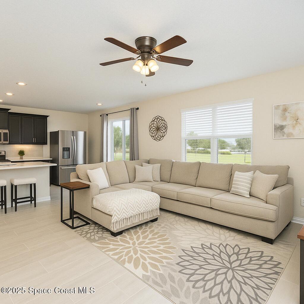 735 Sorrento Drive Cocoa, FL 32922 - Photo 9 of 23 a living room with furniture and a large window