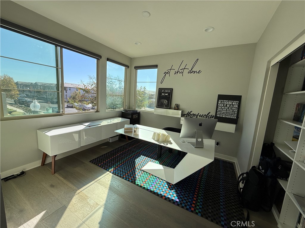 101 Interval Irvine, CA 92618 - Photo 12 of 20 a reading room with furniture a rug and a large window